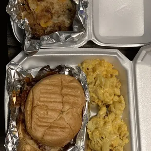 Spicy pulled pork sandwich with avocado, side of smoked Mac &amp; cheese Peach cobbler