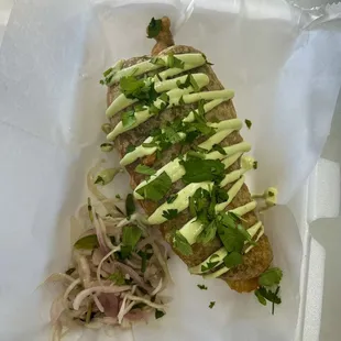 a piece of food in a styrofoam container