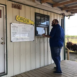 a man standing in front of a store