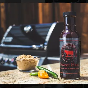 Our homemade bbq sauce &quot;Sweet Heat&quot; if you like hot you will appreciate this. Just enough kick to know its packing heat. smokinwoodsbbq.com