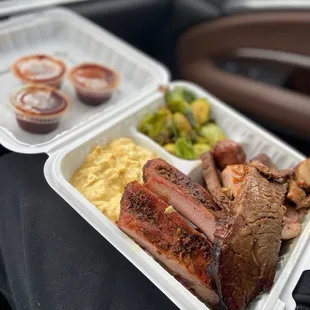 a meal in a styrofoam container