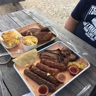 Smoked chicken, brisket, sausage, macaroni and cheese, and cornbread pudding