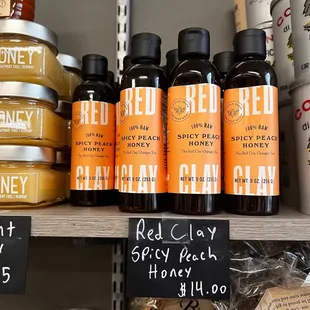 a shelf of honey and honey products