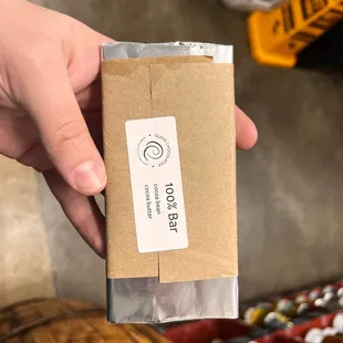 a person holding a box of cigarettes