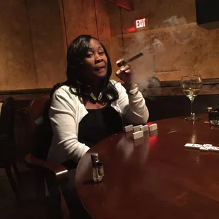 a woman smoking a cigar