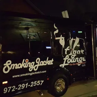 a black truck parked on the side of the road