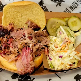 Pulled pork sandwich and coleslaw.