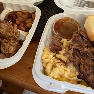 Pulled pork platter w/cornbread &amp; baked beans; mac'n'meat w/chopped brisket.