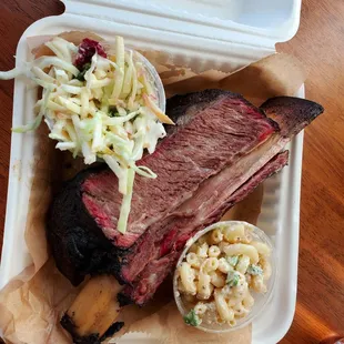 meat and coleslaw in a styrofoam container
