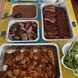 The whole spread: bbq chicken, tritip, ribs, beans, rolls, and bacon Mac. We made our own salad.