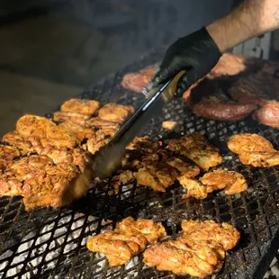 Jumbo chicken thighs and reverse seared Tri-Tip on our open pit, Santa Maria grill!