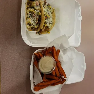 a meal in a styrofoam container