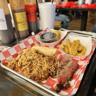 Pulled pork, pulled chicken, pickle fries, sweet corn bread, pulled pork egg roll