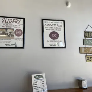 a menu and a sign on the wall