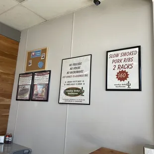 signs on the wall of a restaurant
