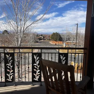 Rocking chairs outside with views of the mountains