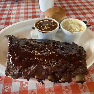  a plate of ribs and sides