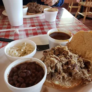 Pork sandwich with coleslaw and beans for me. Hubby has brisket and beans. Missing our favorite waitress again.