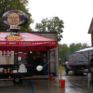 Grand opening . . . ever see a spinning pig on top of a tent . . . ?