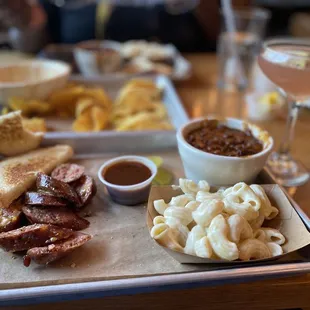 Jalapeno-Cheddar Sausage Link, House Mac, and BBQ Beans. Front Porch Cosmo Martini