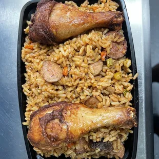a tray of rice and chicken