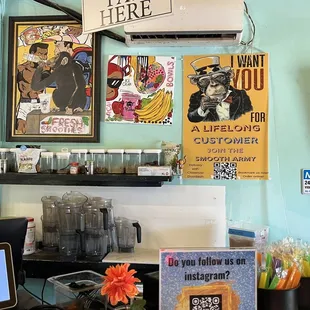 a small bar with posters on the wall