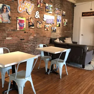 a living room with exposed brick walls