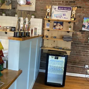 a counter with a small fridge
