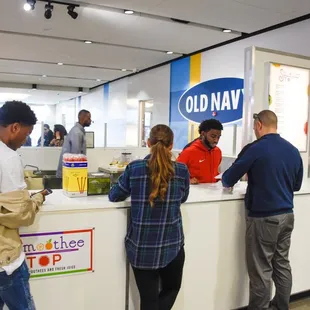 a group of people at a counter