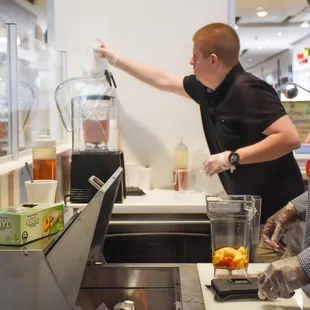 a man and a woman in a kitchen