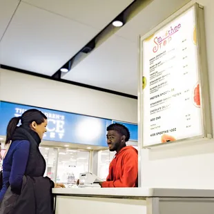 a man and a woman at a counter