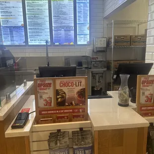 the counter and menus of a fast food restaurant