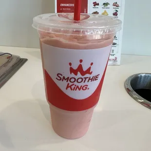 a smoothie in a plastic cup