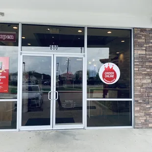 the front entrance of a restaurant