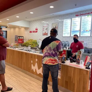 two men standing in front of a counter