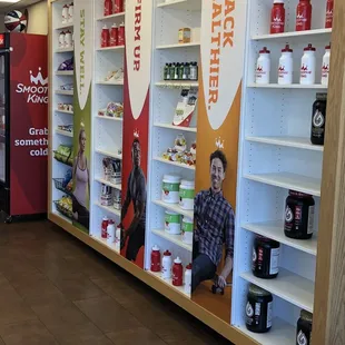 a man sitting on a shelf in a store