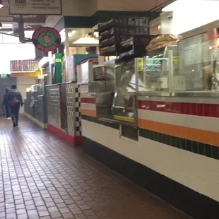 people walking in a subway station