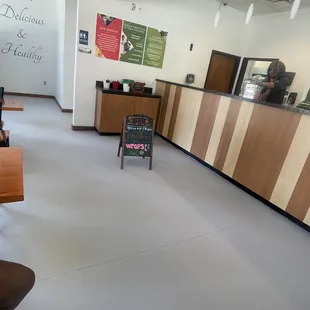 the counter and seating area of a smoothie shop