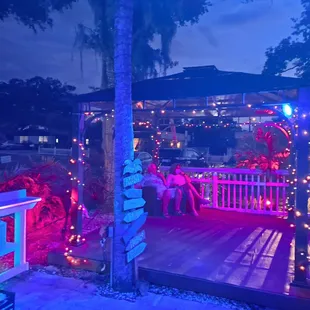 a gazebo lit up at night