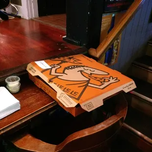 a pizza box on a table