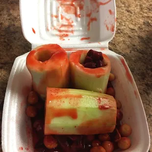 a container of beans and celery