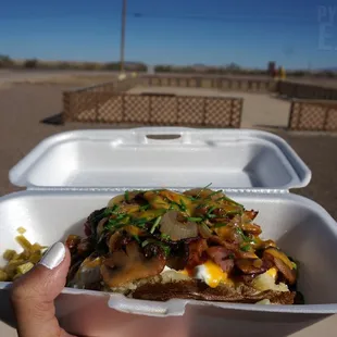 Texas Tater - mine has Mushrooms, Broccoli, Jalapenos, Cheese, Sour Cream, Chives, Cilantro... uhh.. maybe more