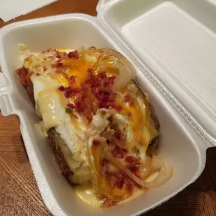 Another Texas Tater! This one has queso, shredded cheese, butter, bacon bits, sour cream, &amp;  sautéed onion.