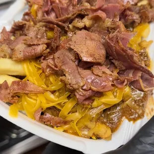 a person holding a plate of food