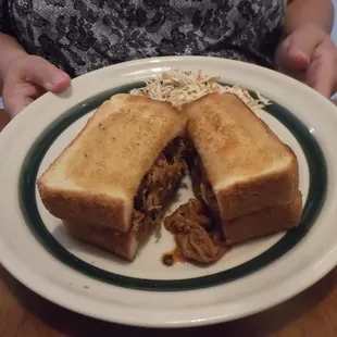 a plate with a sandwich cut in half