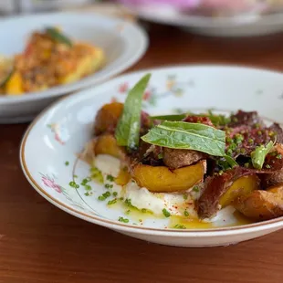 Fingerling potatoes with Jamón Iberico. caramelized shallot, Mt Tam cheese sauce