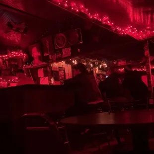 a bar with red lights