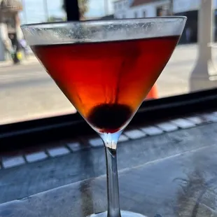 a close up of a drink in a martini glass
