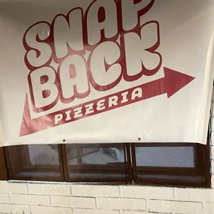 a sign in front of a window