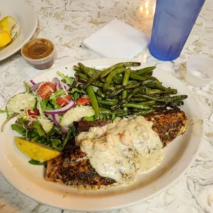 Red snapper with shrimp étouffé sauce with side salad and green beans.